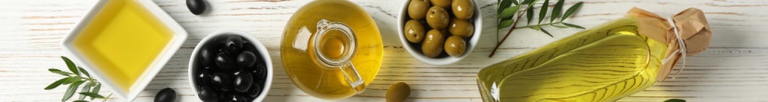 flat-lay-with-bottle-jug-bowl-with-olive-oil-olives-wooden-space-text